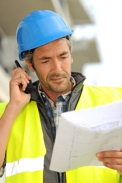 Portrait of construction manager using walkie-talkie - Zdjęcie, obraz