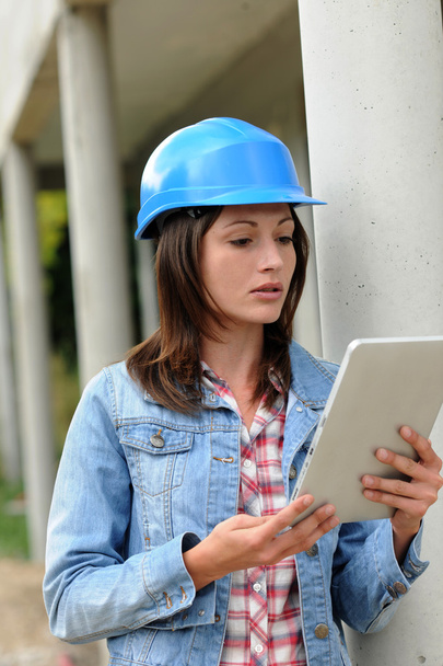 Architect on building site working with electronic tablet - Foto, imagen