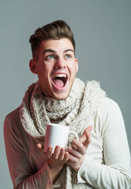 handsome guy with cup in scarf - Valokuva, kuva