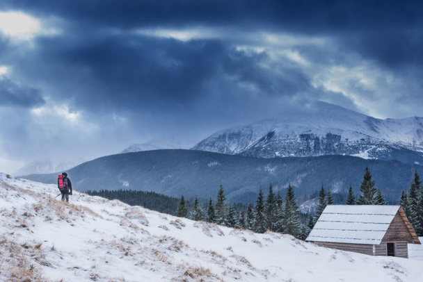 Winter camp for tourist with the harmonic mountain view. Lonely hut without fire among snowy giant - Φωτογραφία, εικόνα
