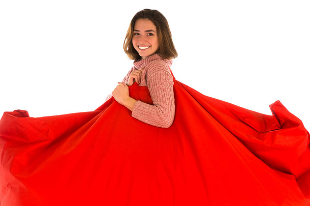 Smiling woman holding on her shoulder red rectangular shaped bea - Foto, Bild