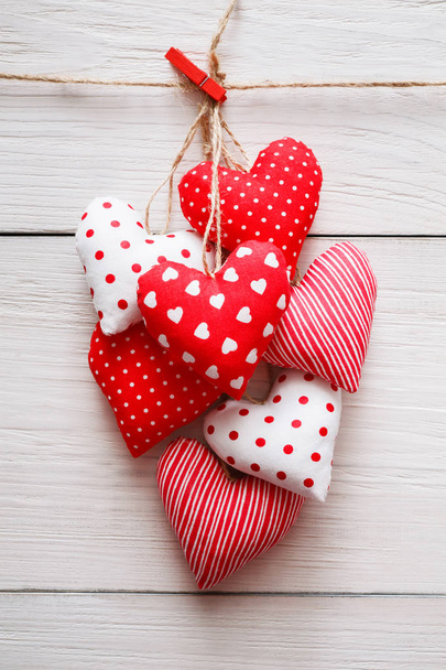 Valentine day background, pillow hearts bunch on wood, copy space - Photo, Image