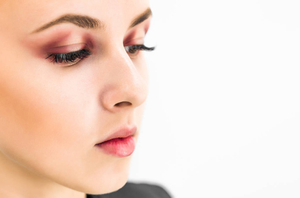 Woman with natural make-up eyes and lips looking to the side. Close-up - Photo, Image
