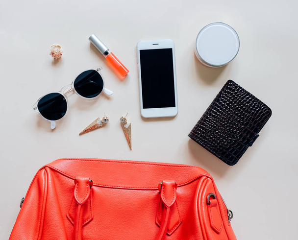 Flat lay of red leather woman bag  - Foto, afbeelding