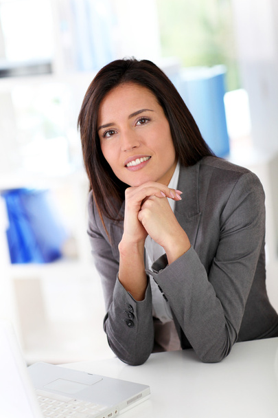 Businesswoman sitting in front of laptop computer - Φωτογραφία, εικόνα