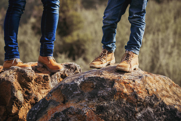 mother and son hiking boots in mountains - 写真・画像