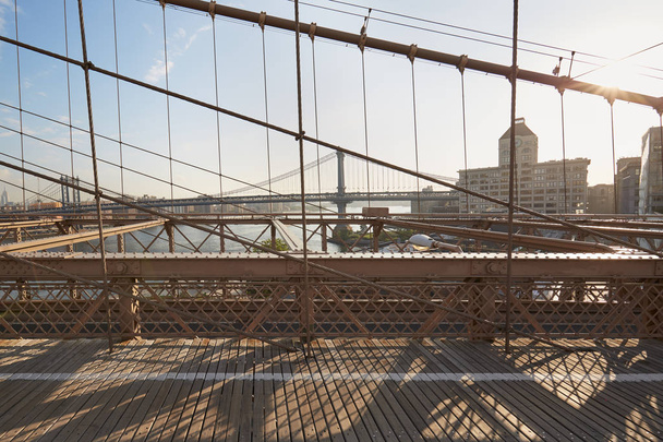 Empty Brooklyn Bridge pedestrian footpath in the morning, New York - Φωτογραφία, εικόνα
