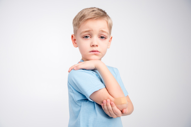 Little boy with patch on elbow - Φωτογραφία, εικόνα