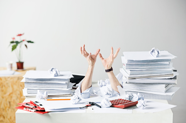 The many crumpled papers on desk of stressed male workplace - 写真・画像