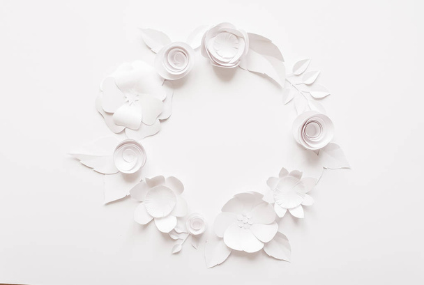 Round frame with white paper flowers - Photo, Image