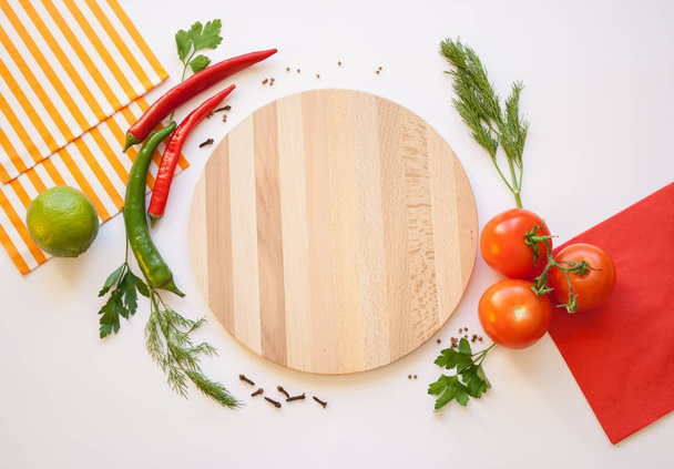 Vegetables on a white background and Cutting board - Фото, зображення