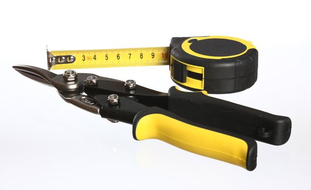 Construction tools snips and tape measure - Foto, immagini