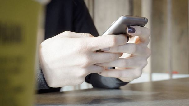 phone in female hand. Social networks and communication - Valokuva, kuva