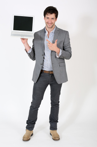 Young businessman pointing at laptop screen - Foto, Imagem