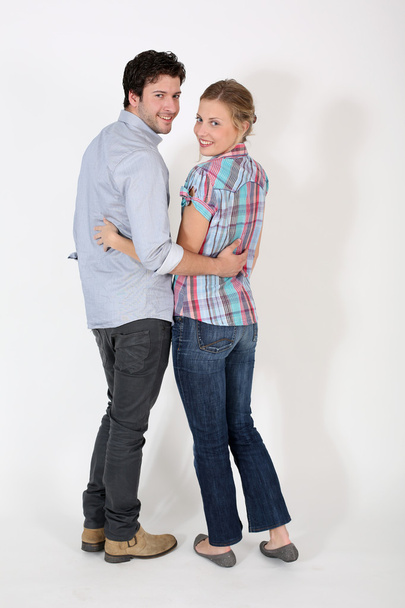 Young cute couple standing on white background - Foto, immagini