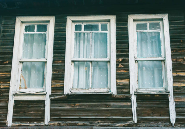 Three old windows, antique wooden windows, windows in a wooden h - Foto, imagen