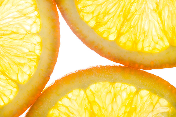 Orange in a cut on white background - Fotó, kép