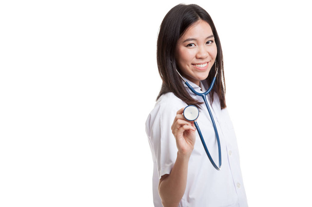 Young Asian female doctor with stethoscope. - Фото, изображение