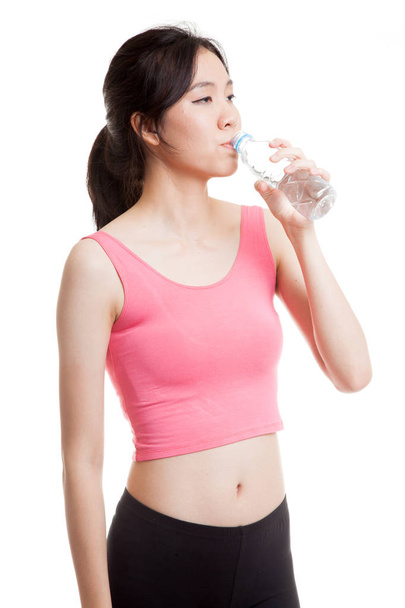 Beautiful Asian healthy girl with bottle of drinking water. - Фото, изображение