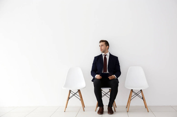 Young man waiting for job interview - Фото, изображение