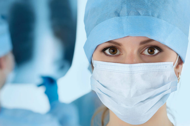 Close up portrait of young female surgeon doctor - Fotó, kép