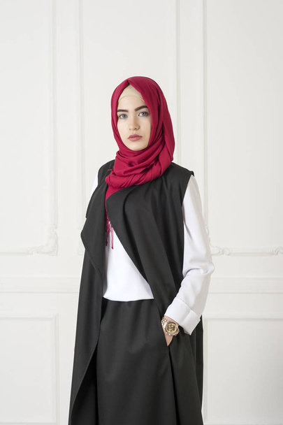 Islamic beautiful woman in a modern oriental dress, studio photo - Foto, Imagem