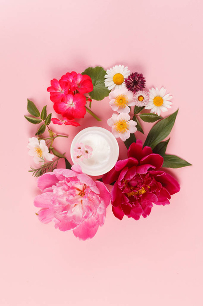 cosmetic creams with flowers  - Foto, Bild