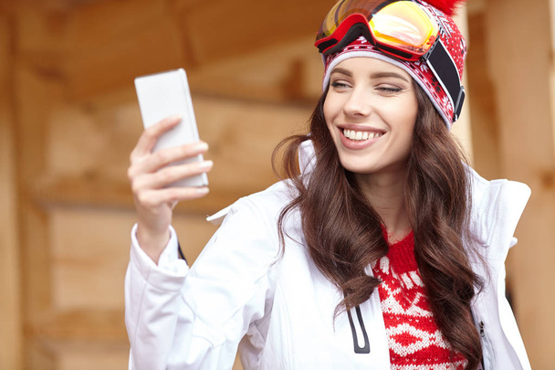 Young girl in snowboarding clothes  - 写真・画像