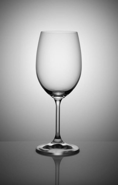 empty wine glass isolated on light gray background - Foto, Bild