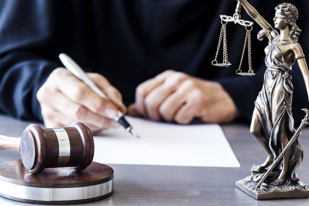 Judge with wooden gavel on table - Фото, зображення