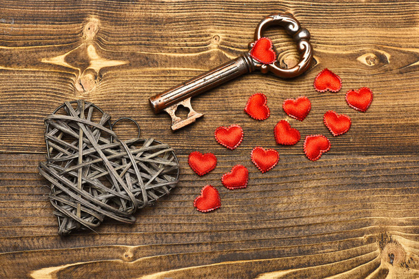 silver heart and metallic key on wood as valentines decoration - Photo, Image