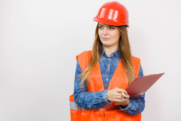 Woman engineer construction builder in helmet. - Valokuva, kuva