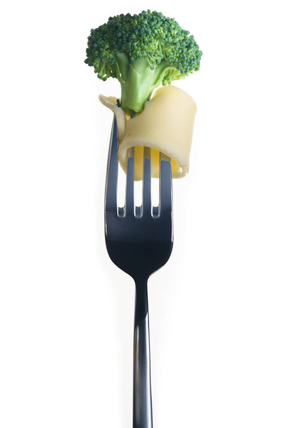Fresh Broccoli on fork  white background - Photo, Image