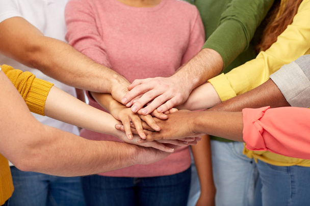 group of international people with hands together - Foto, Bild