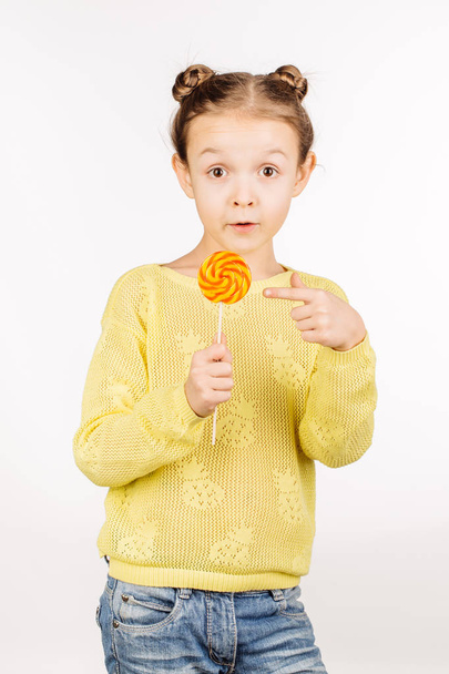 little girl with lollipop - Фото, изображение