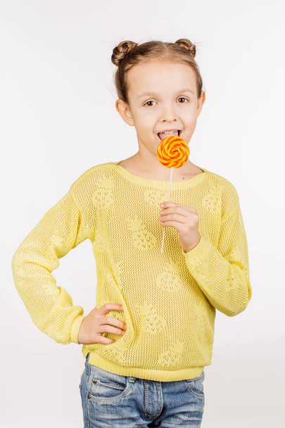 girl licking round lollypop - Фото, изображение