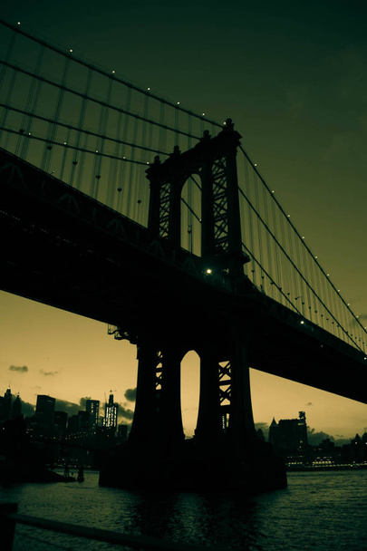 Manhattan bridge in silhouette in green vintage color style - 写真・画像