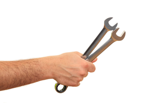 Hand holding spanners on white background - Photo, Image