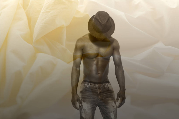 Double exposure of bare-chested african man and sheets - Foto, Imagen