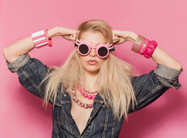 Barbie pop girl portrait wearing odd sunglasses and posing - Photo, Image