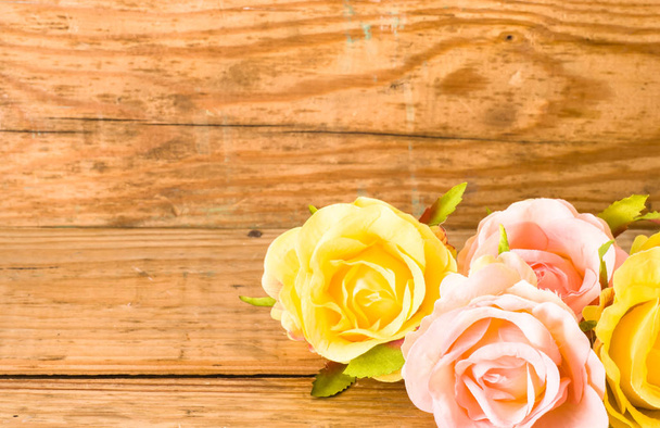 Bright roses on wooden background, frame card for women's day - Fotoğraf, Görsel