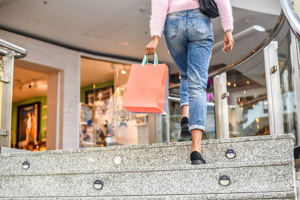 woman shopping in a shopping center with bags - Foto, Bild