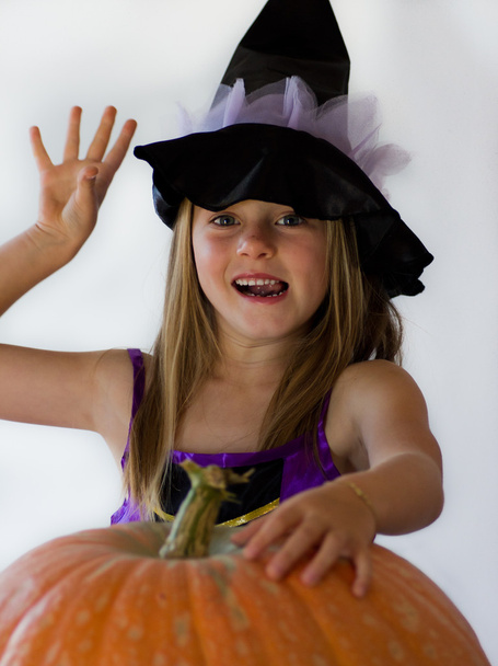 Little witch with pumpkin - 写真・画像