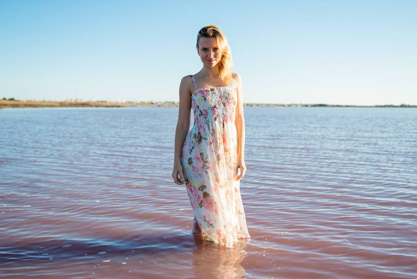 Blonde woman in a beautiful salt lake - Photo, Image