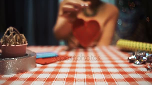 Middle finger hidden beside red heart, stupid love hate symbol - Footage, Video