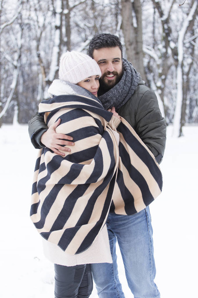 beautiful couple in love in the winter park - 写真・画像