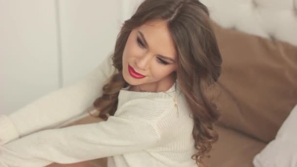 woman sitting on bed - Video, Çekim