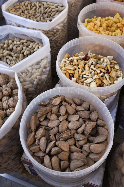 Dry nuts for sale in a local market - Foto, imagen