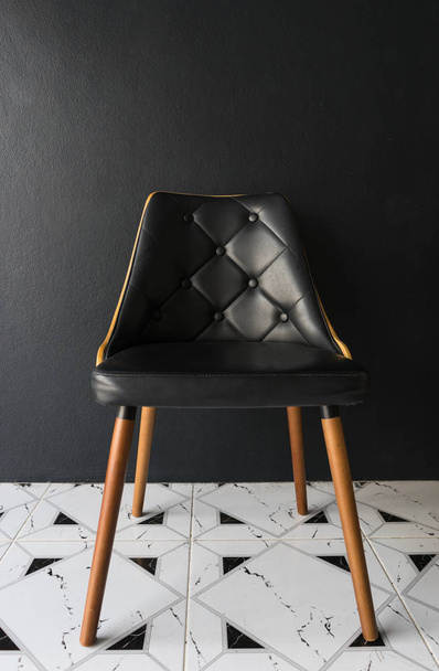 Black chair with black background - Фото, изображение