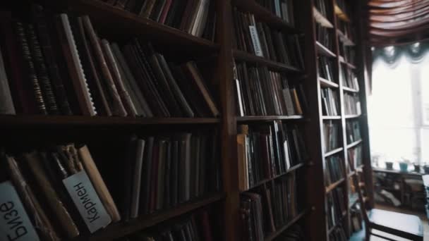Panoramic shot old style library interior. Wooden floor. bookshelves archives - Footage, Video